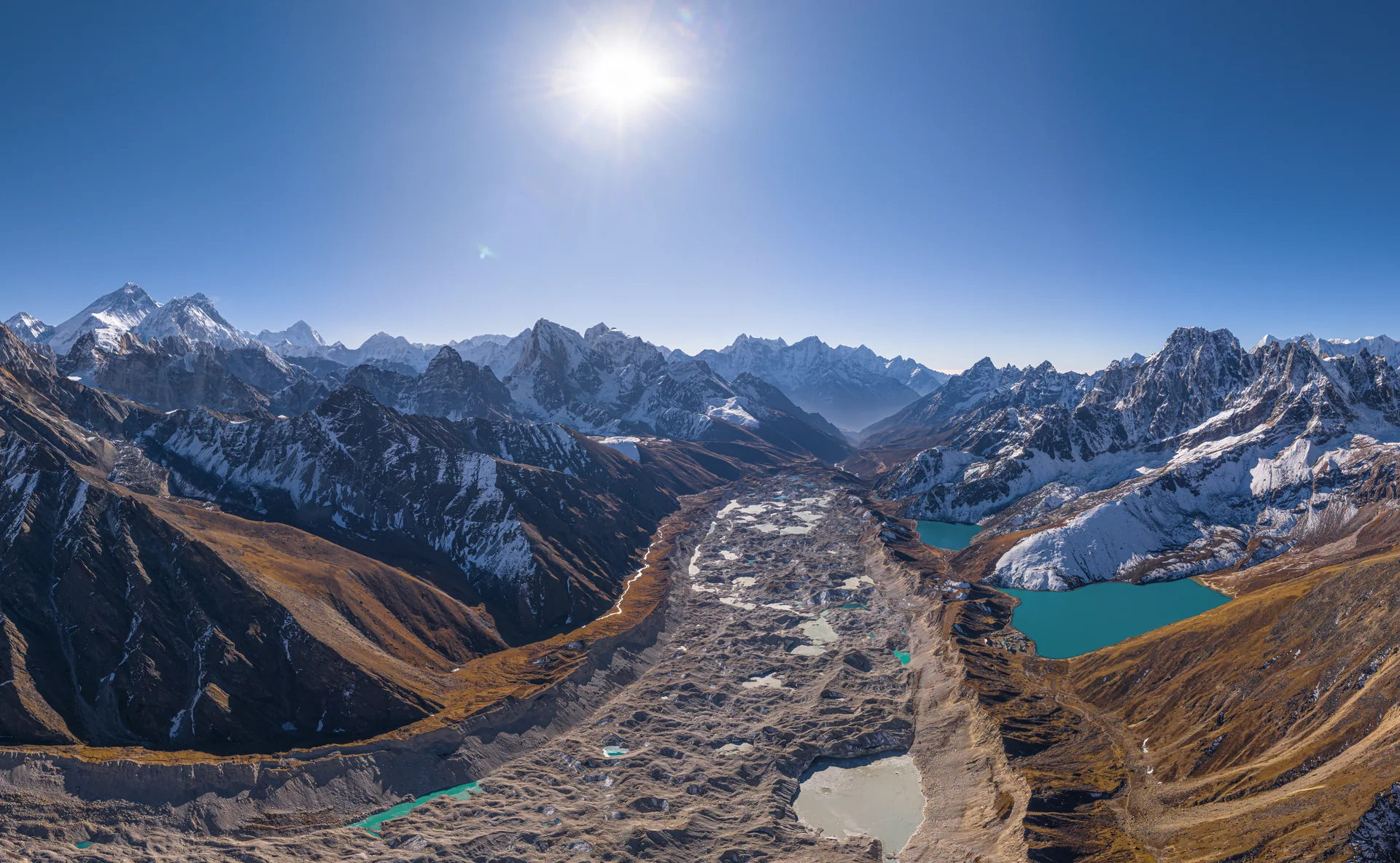 An aerial view across Ngozumpa Glacier, Gokyo lakes and surrounding Himalayan ridges